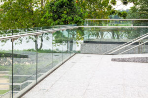 Unstable Balustrades Along Contemporary Glass Terrace Overlooking Nature