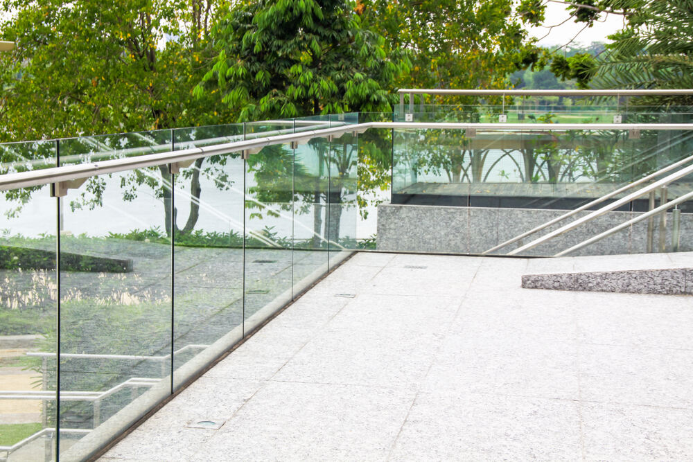 Unstable Balustrades Along Contemporary Glass Terrace Overlooking Nature